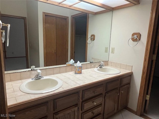 bathroom featuring tile patterned floors and vanity