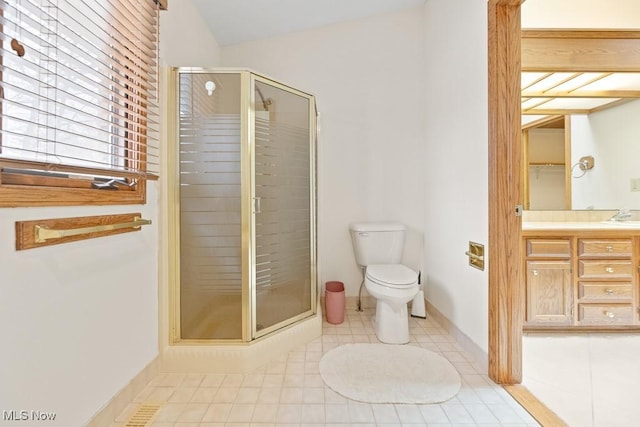 full bathroom featuring toilet, a stall shower, tile patterned flooring, lofted ceiling, and vanity