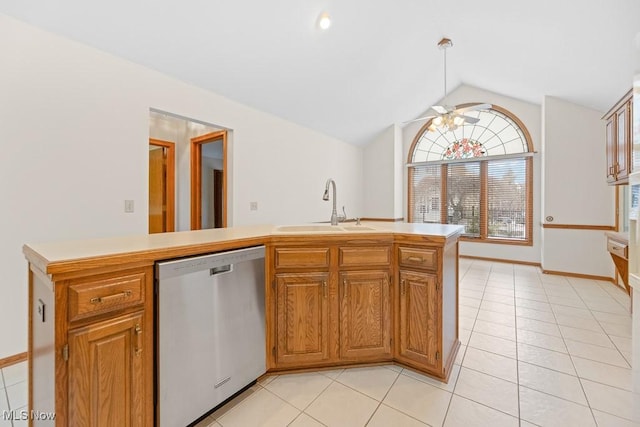 kitchen with a sink, stainless steel dishwasher, light countertops, lofted ceiling, and ceiling fan