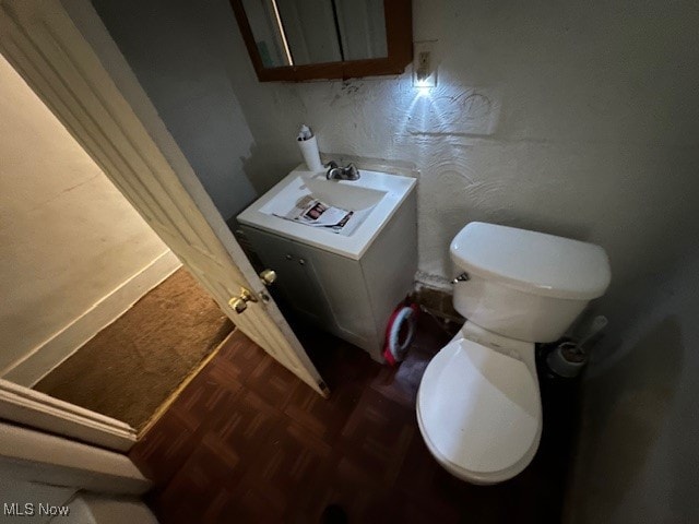 bathroom featuring toilet and parquet floors