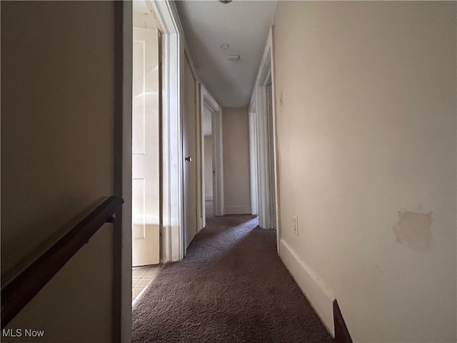 corridor with dark carpet