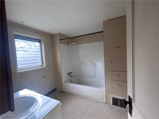 bathroom with vanity and shower / bathtub combination