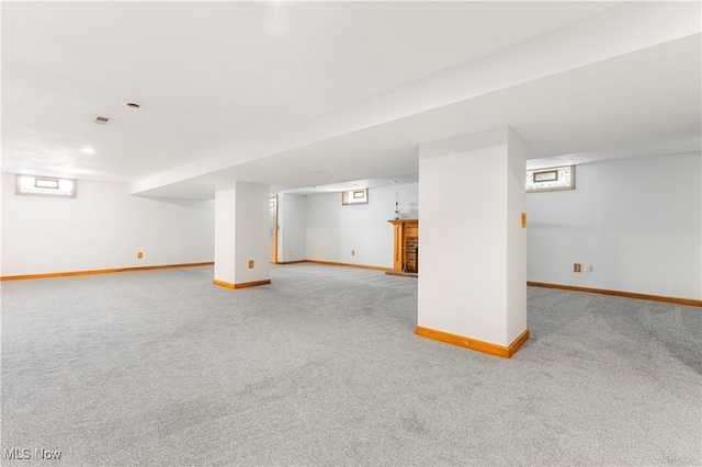 basement with light colored carpet