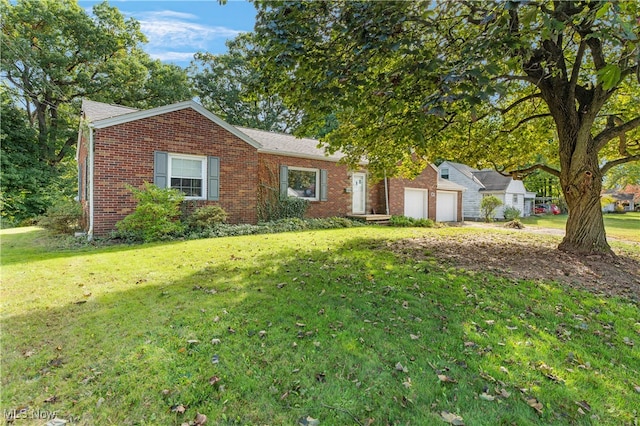 ranch-style home with a garage and a front lawn