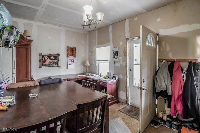 carpeted dining room with a notable chandelier