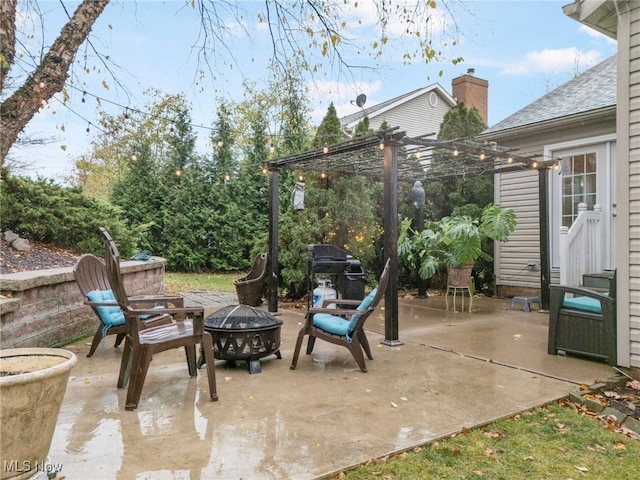 view of patio / terrace featuring a fire pit