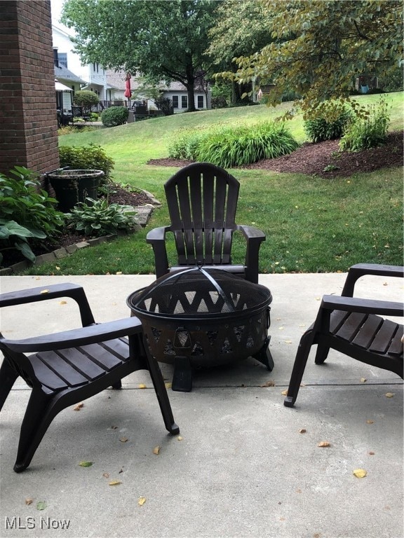 view of patio with a fire pit