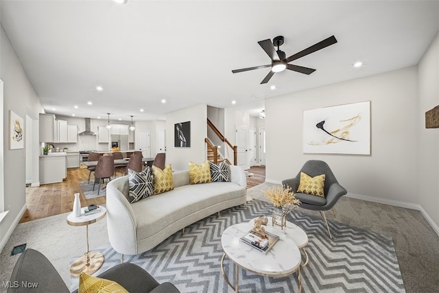 living room with ceiling fan and wood-type flooring