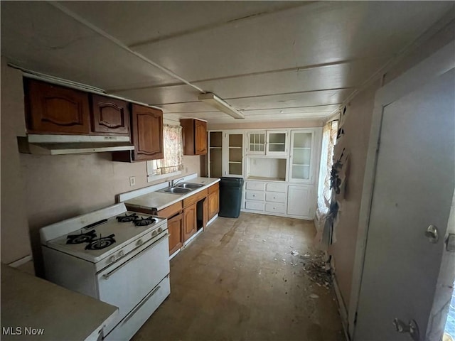 kitchen featuring sink and white gas range oven