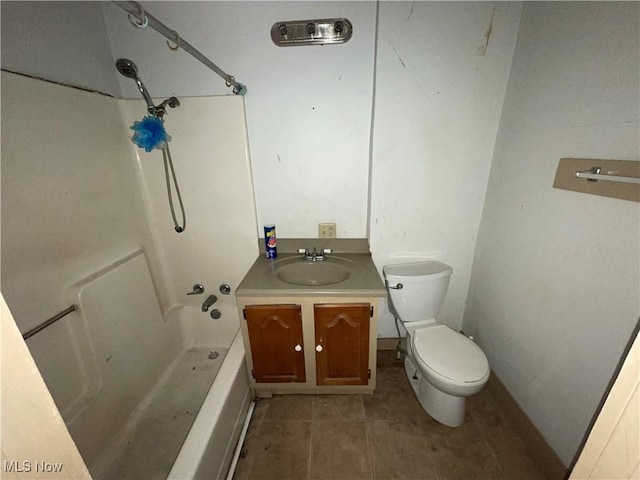 full bathroom featuring tile patterned floors, vanity, toilet, and washtub / shower combination