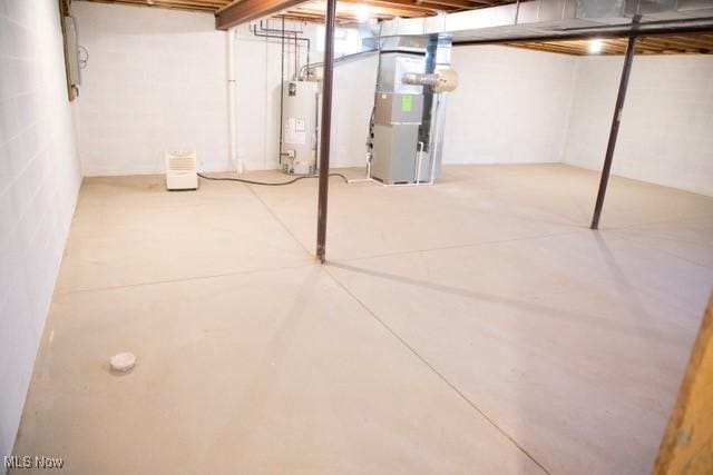 basement with gas water heater and heating unit