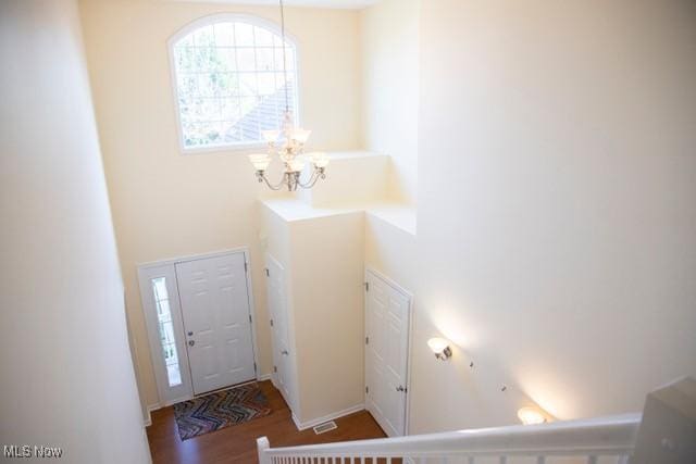 foyer featuring a chandelier and hardwood / wood-style flooring