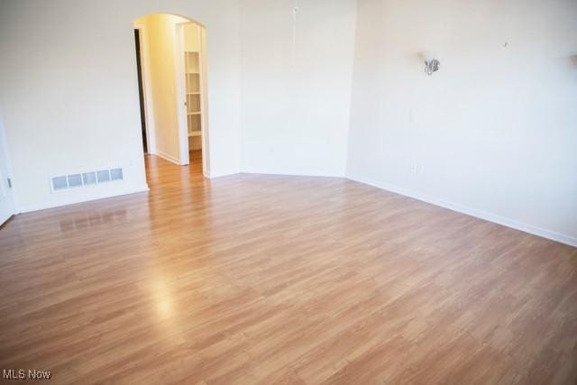 spare room with wood-type flooring