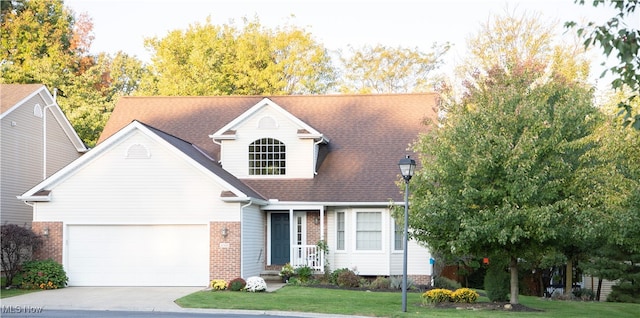 view of front of home featuring a front yard and a garage