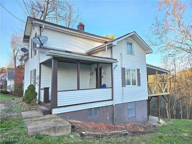 exterior space with a balcony and a porch