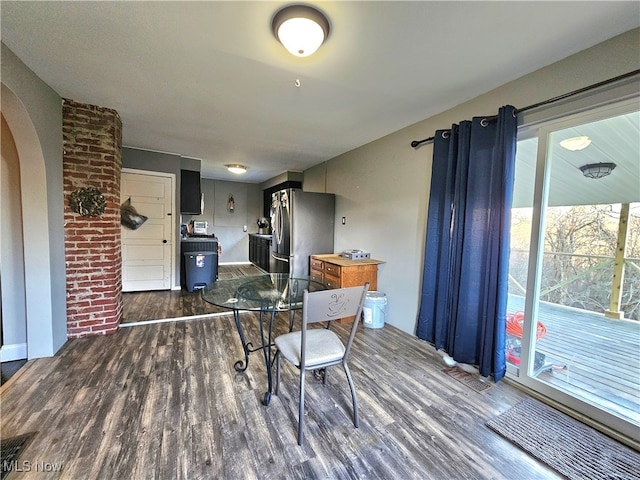 dining space featuring dark hardwood / wood-style flooring