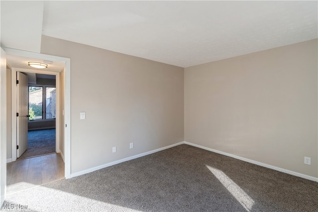 empty room with carpet flooring