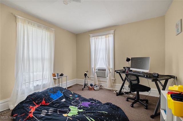 bedroom featuring carpet flooring, multiple windows, and cooling unit