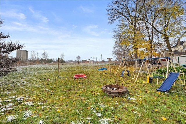 view of play area with a fire pit