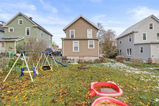 rear view of house with a playground