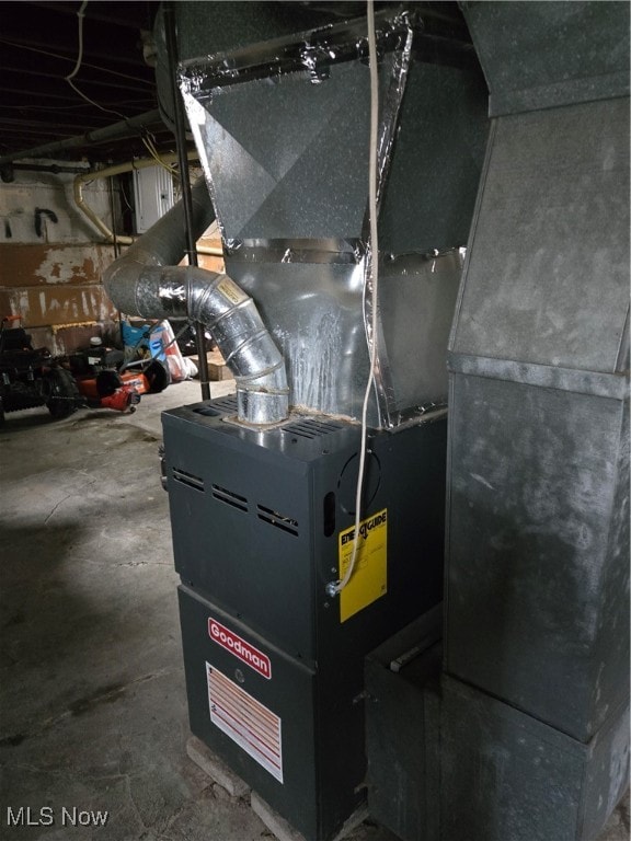 utility room featuring heating unit