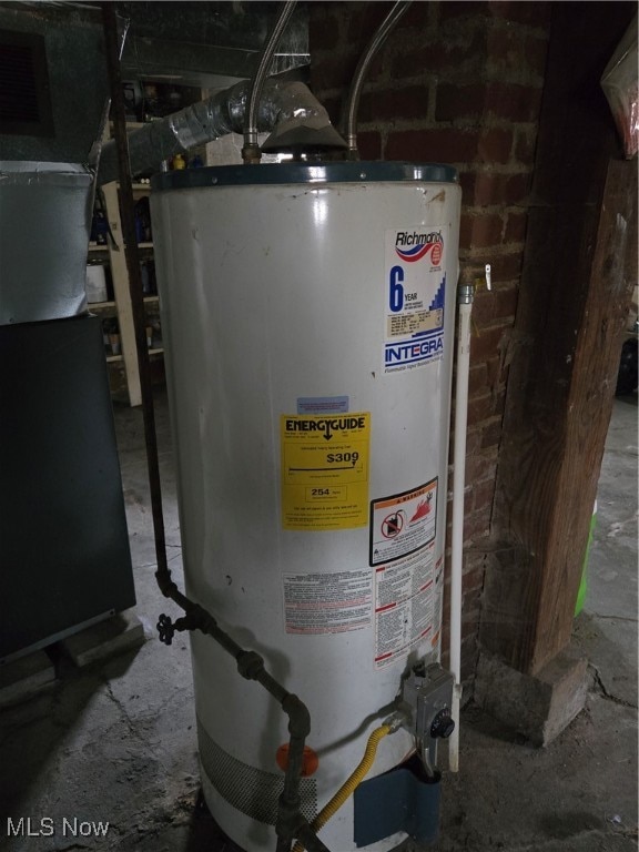 utility room featuring gas water heater