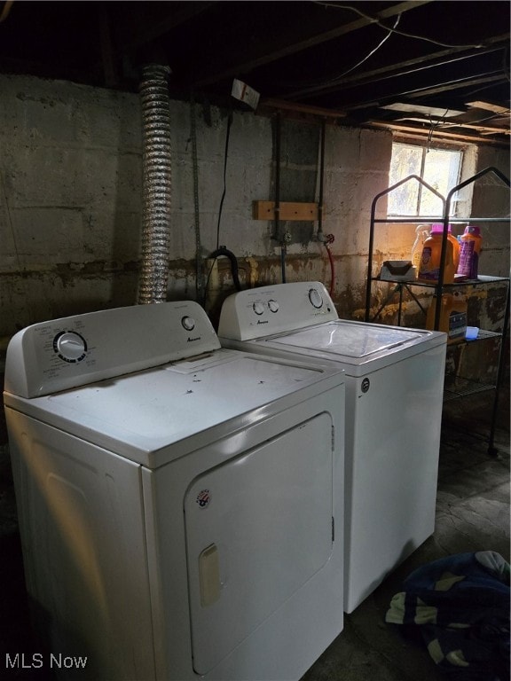 washroom with independent washer and dryer