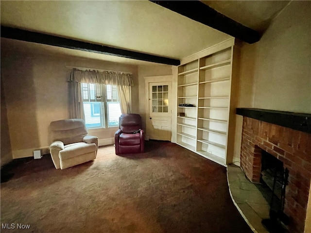 living area featuring carpet floors, a fireplace, and beamed ceiling