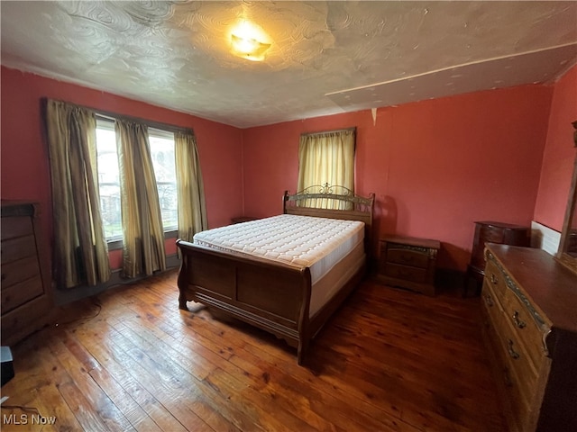 bedroom featuring dark hardwood / wood-style floors