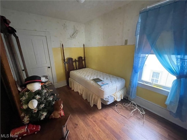 520 E Lincoln Way, Lisbon, OH 44432 - bedroom with wallpapered walls and wood finished floors