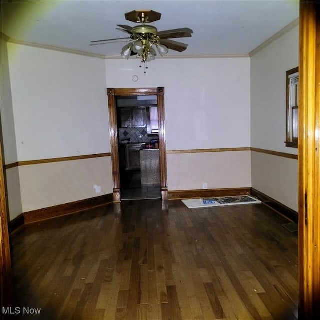 unfurnished room with crown molding, ceiling fan, and hardwood / wood-style floors