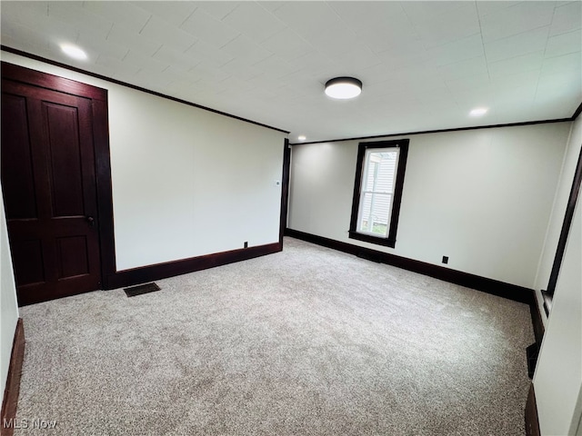 interior space with light colored carpet and crown molding