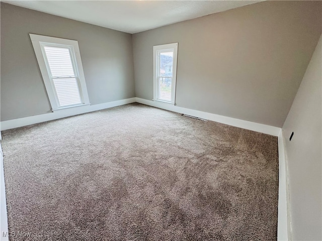 view of carpeted spare room