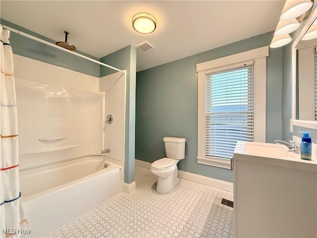 full bathroom with vanity, shower / bath combination with curtain, and toilet