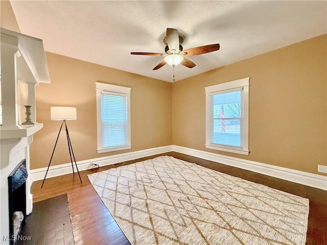 spare room featuring hardwood / wood-style floors and ceiling fan