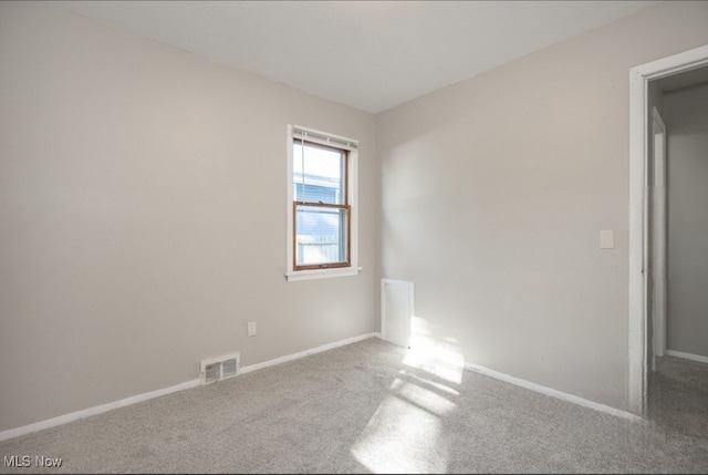 unfurnished room with carpet floors