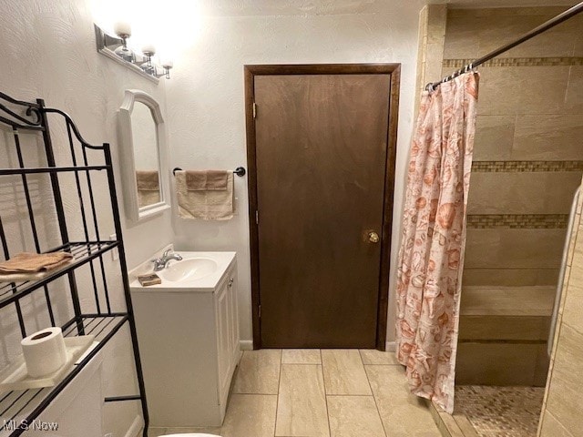 bathroom featuring vanity and walk in shower