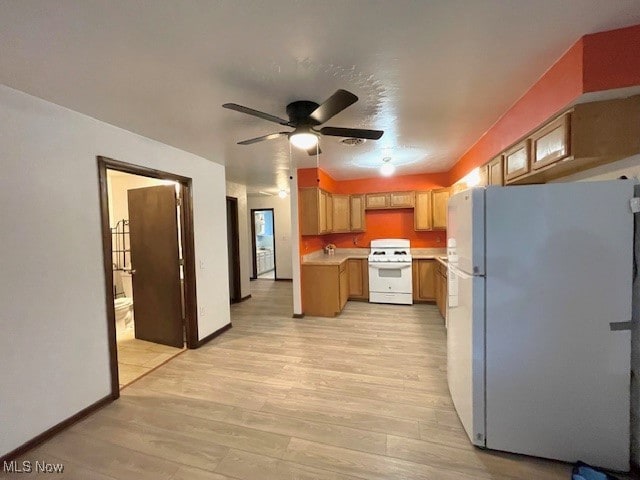 kitchen featuring ceiling fan, light wood-type flooring, and white appliances