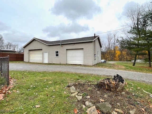 garage featuring a yard