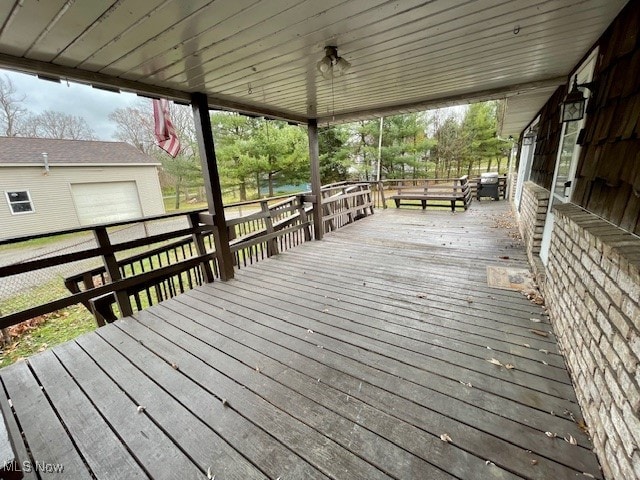 wooden deck with an outbuilding