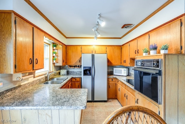 kitchen featuring kitchen peninsula, crown molding, sink, black appliances, and light tile patterned floors