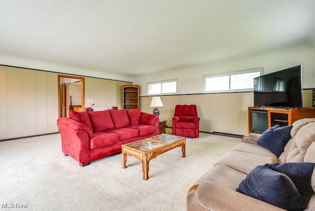 carpeted living room featuring a textured ceiling