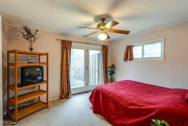 bedroom featuring access to exterior, ceiling fan, light carpet, and multiple windows