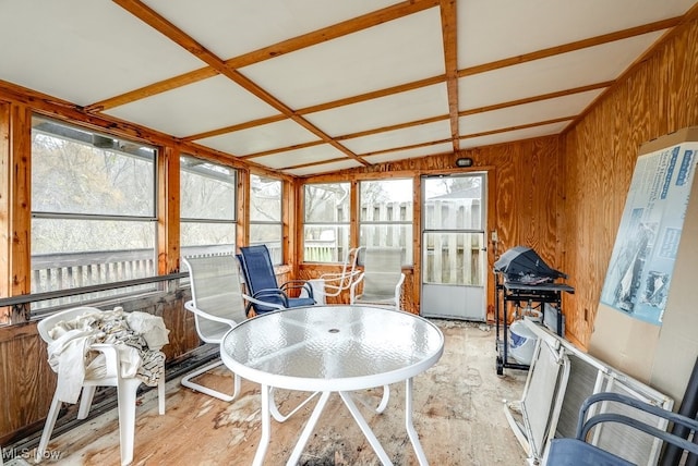 sunroom / solarium with plenty of natural light and lofted ceiling