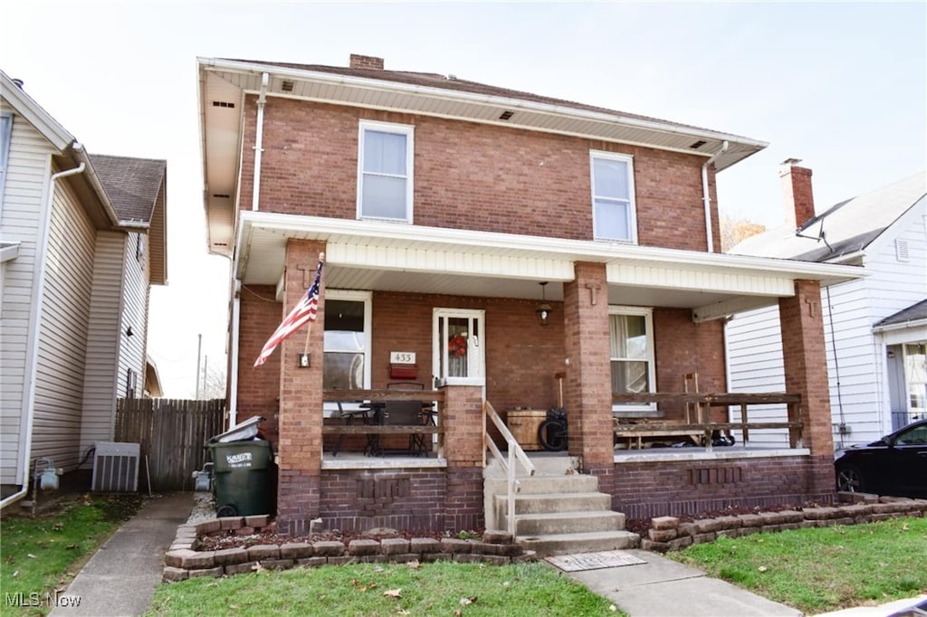 view of front of house featuring covered porch and cooling unit