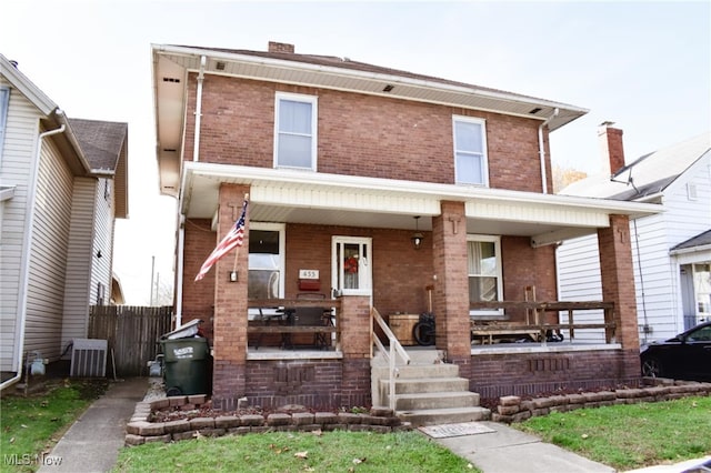 view of front of house featuring covered porch and cooling unit