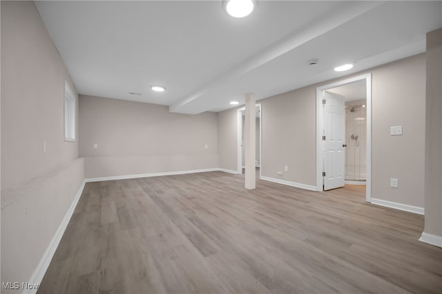 basement featuring light hardwood / wood-style flooring