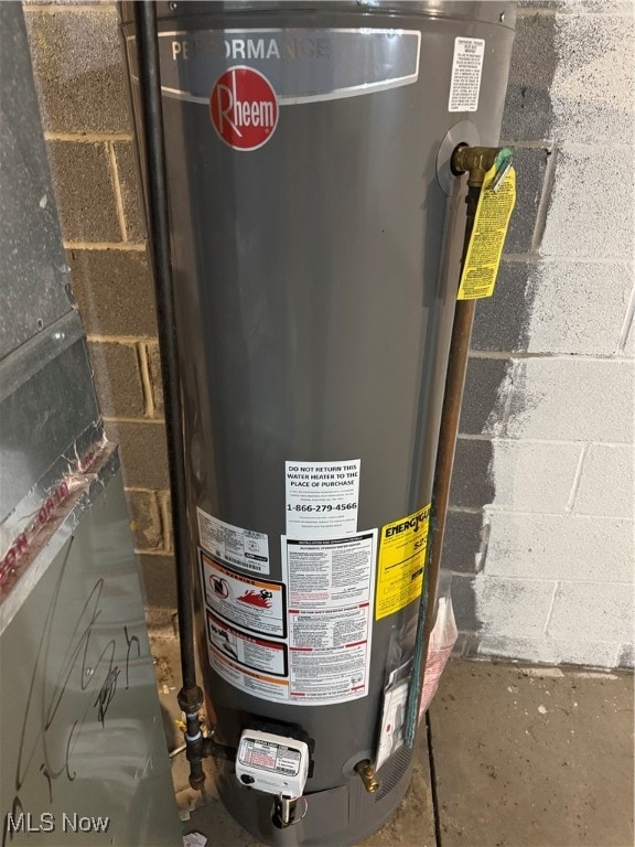 utility room featuring gas water heater