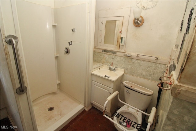 bathroom featuring walk in shower, vanity, and toilet