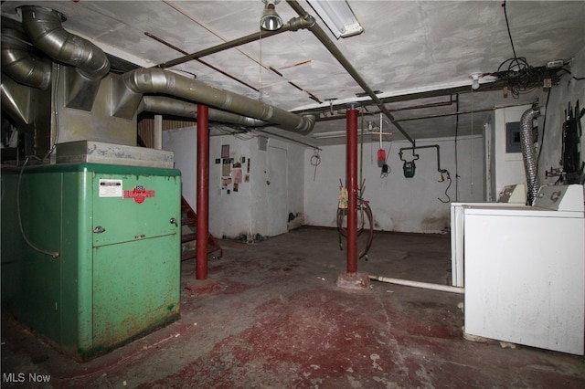 basement with washer / dryer and heating unit